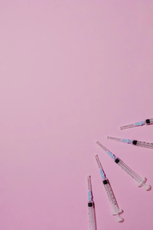 a bunch of syops on a pink background, trending on pexels, conceptual art, syringes, surgical iv bag, ava max, cosmopolitan