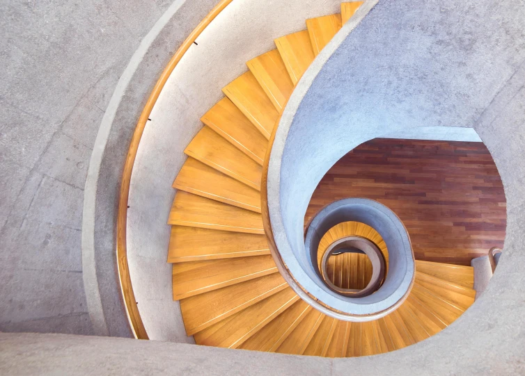 a close up of a spiral staircase in a building, an album cover, inspired by Tadao Ando, pexels contest winner, behance lemanoosh, high angle vertical, john pawson, istockphoto