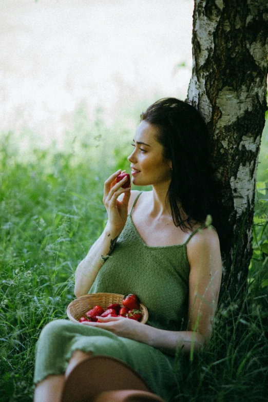 a woman sitting under a tree eating an apple, pexels contest winner, strawberries, olga kurylenko, avatar image, thoughtful )