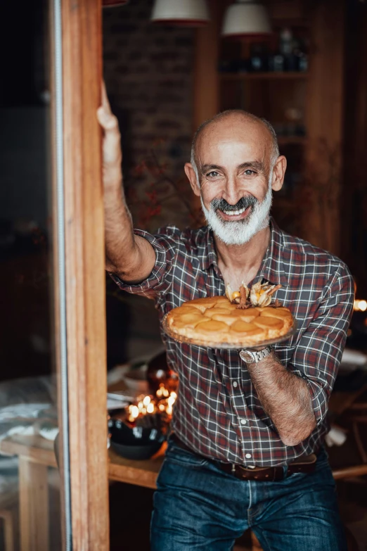 a man with a beard holding a pie, a photo, by Edward Avedisian, pexels contest winner, standing near a window, 2 5 6 x 2 5 6 pixels, woodfired, short white beard