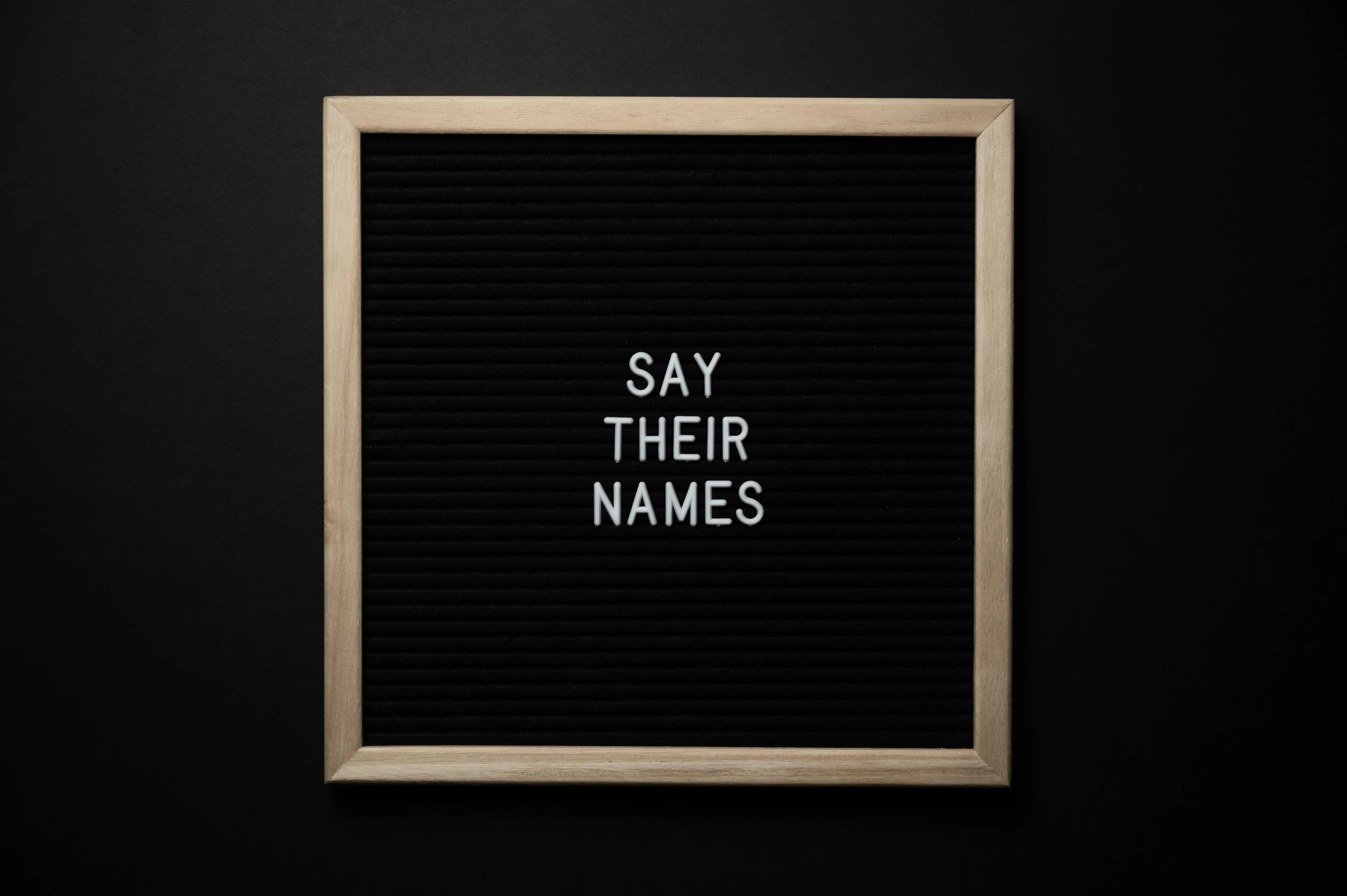 a black letter board with the words say their names, by Carey Morris, pokimane, critically acclaimed, canva, complaints