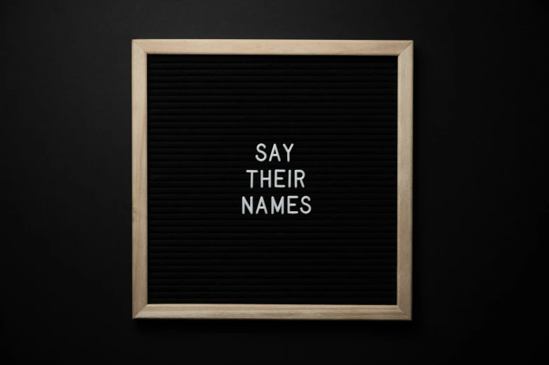 a black letter board with the words say their names, by Carey Morris, pokimane, critically acclaimed, canva, complaints