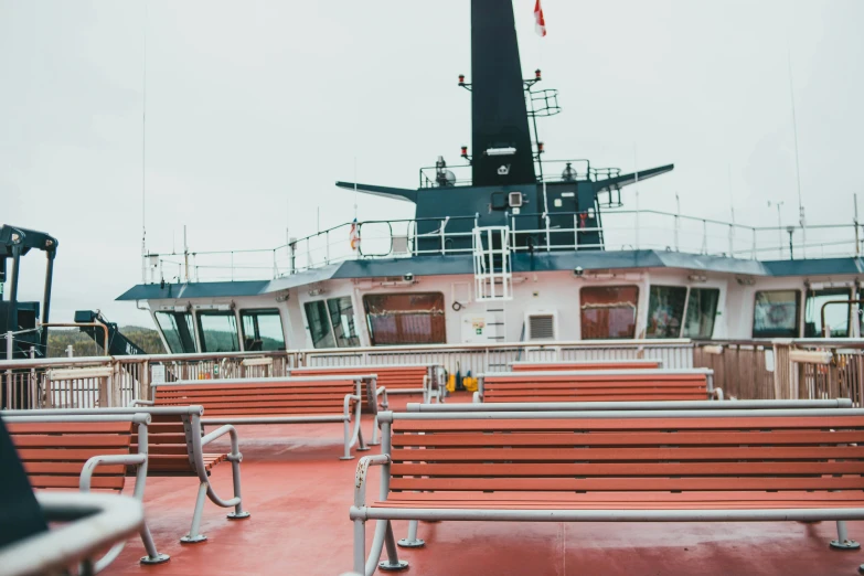 a couple of benches sitting on top of a boat, a portrait, unsplash, on ship, alex heywood, multiple stories, hull