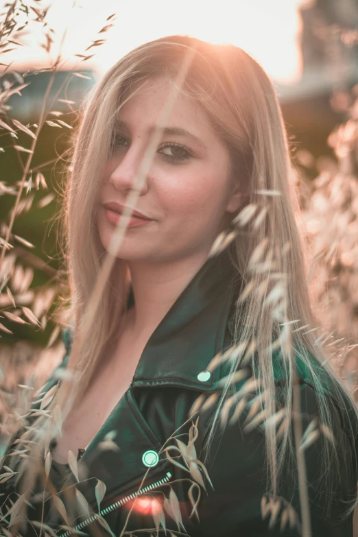 a woman standing in a field of tall grass, inspired by Elsa Bleda, pexels contest winner, renaissance, blond hair green eyes, 🤤 girl portrait, indoor picture, headshot profile picture