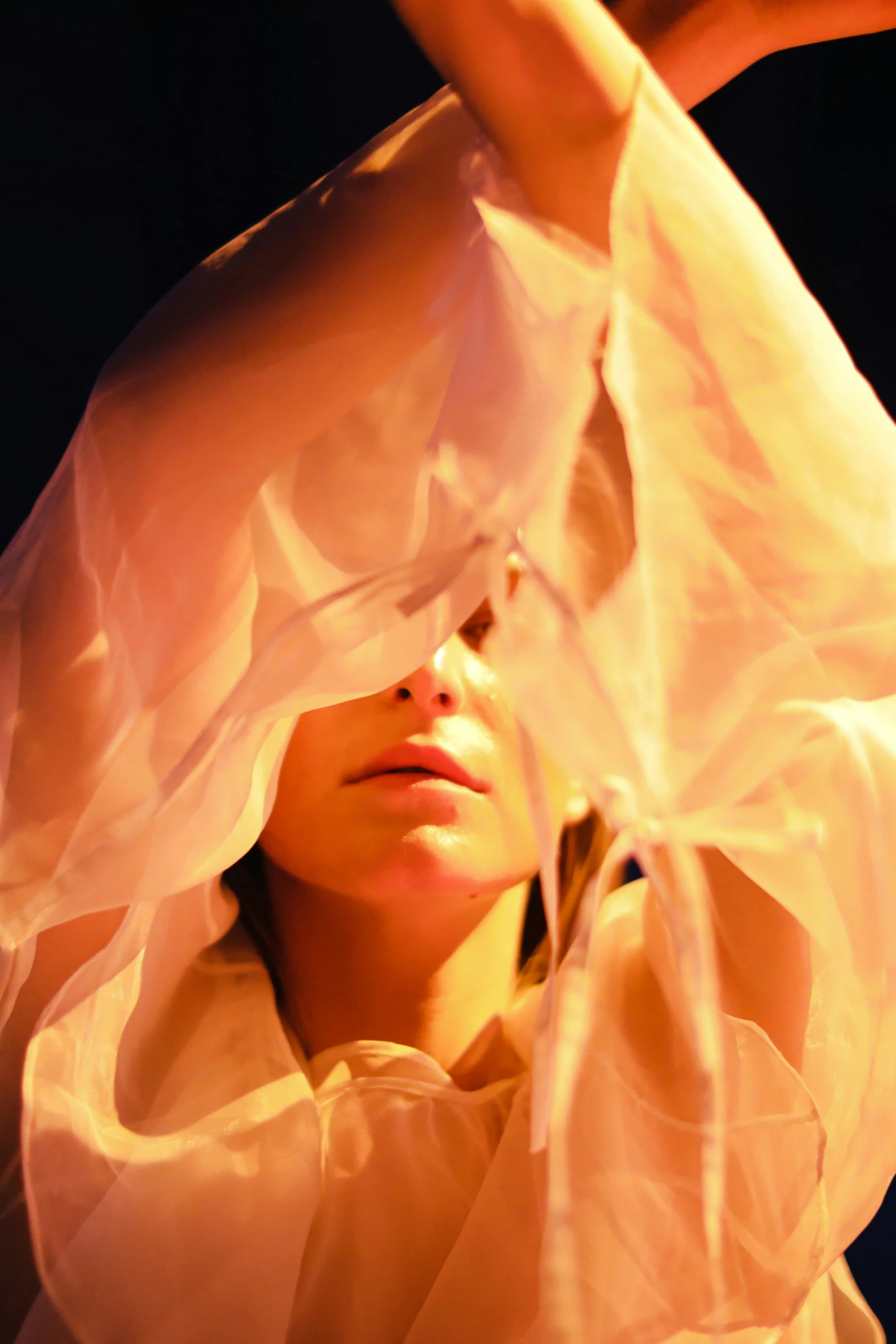 a woman in a white dress holding a cell phone, an album cover, inspired by Anna Füssli, renaissance, draped in flowing fabric, face partially obscured, performance, shot from below