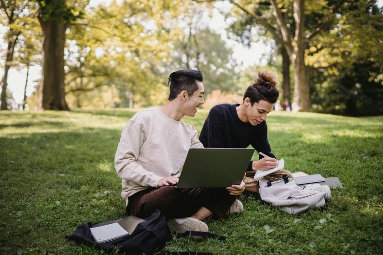 two people sitting on the grass looking at a laptop, by Nicolette Macnamara, pexels, academic art, sydney park, 15081959 21121991 01012000 4k, paper, milan jozing