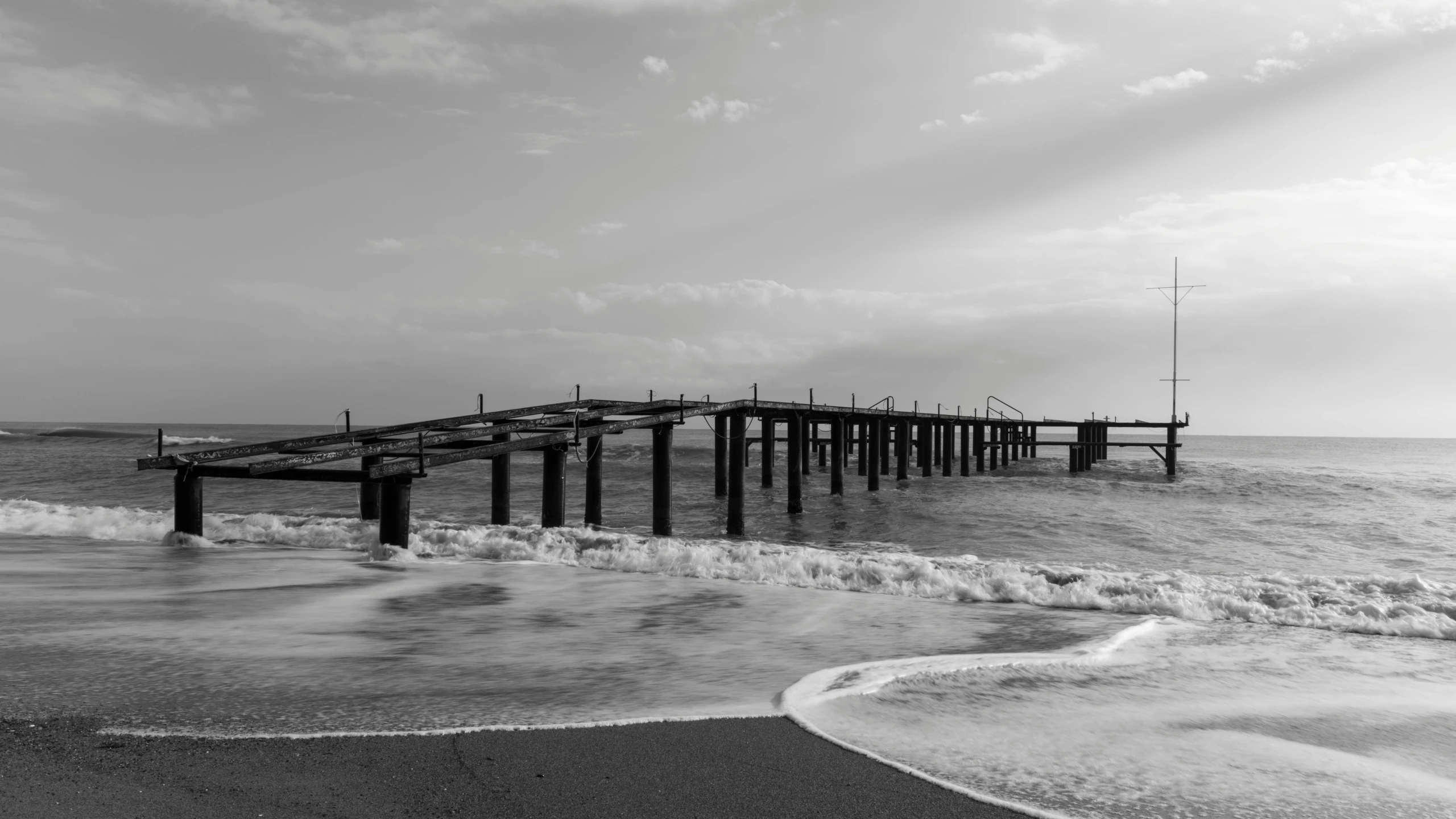 a black and white photo of a pier in the ocean, a black and white photo, inspired by Mario Sironi, pexels contest winner, romanticism, sepia sunshine, beautiful italian beach scene, today\'s featured photograph 4k, 2 5 6 x 2 5 6 pixels