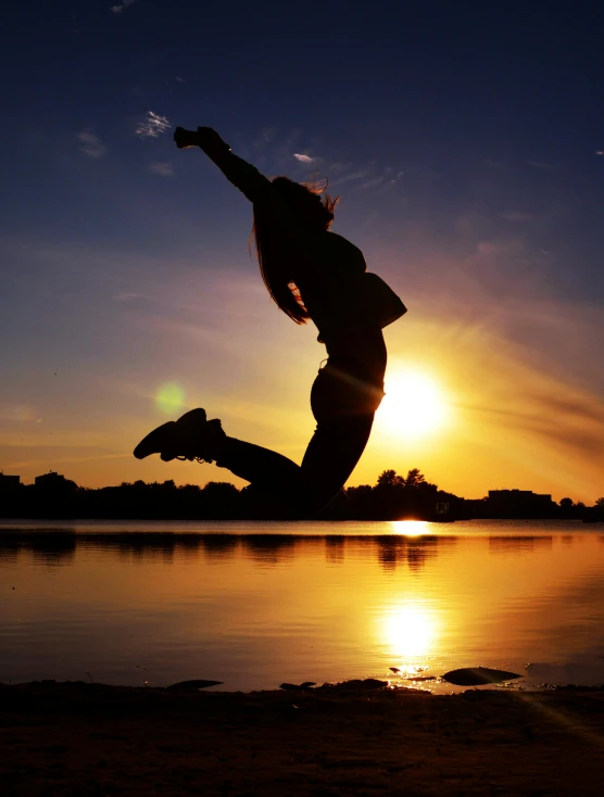 a person jumping into the air at sunset, in a jumping float pose, profile pic, all overly excited, ((sunset))