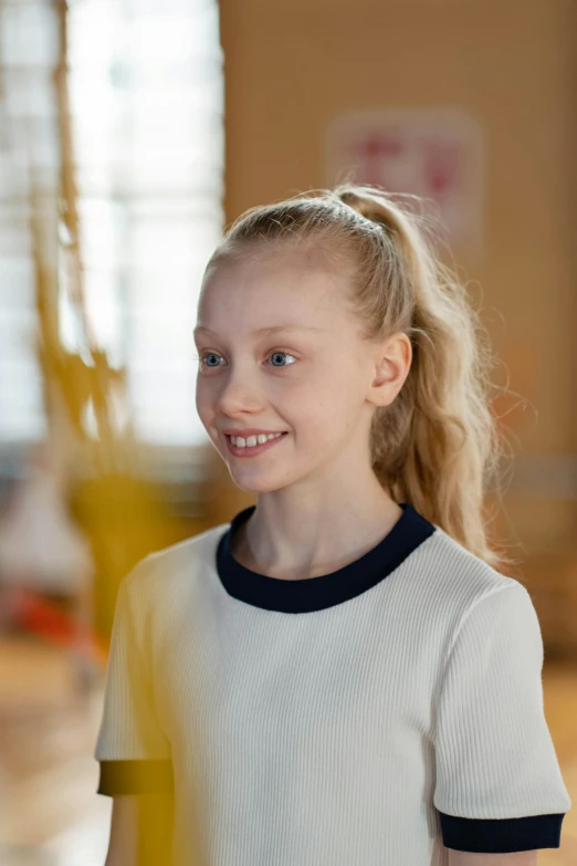 a little girl that is standing in a room, inspired by Sophia Beale, happening, smirking, cast, close up to a skinny, bowater charlie