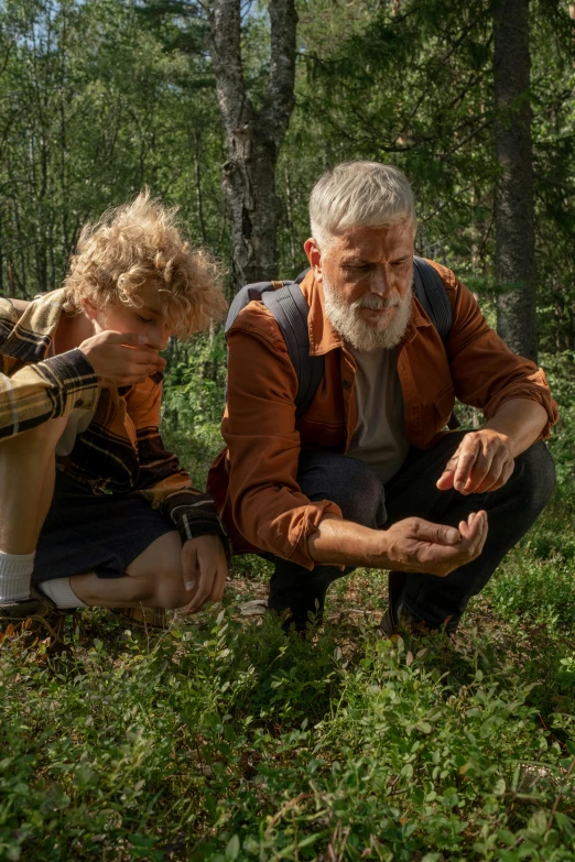 a couple of people that are sitting in the grass, by Jaakko Mattila, trending on reddit, naturalism, old growth forest, an old man with a ginger beard, still from loki ( 2 0 2 1 ), geology
