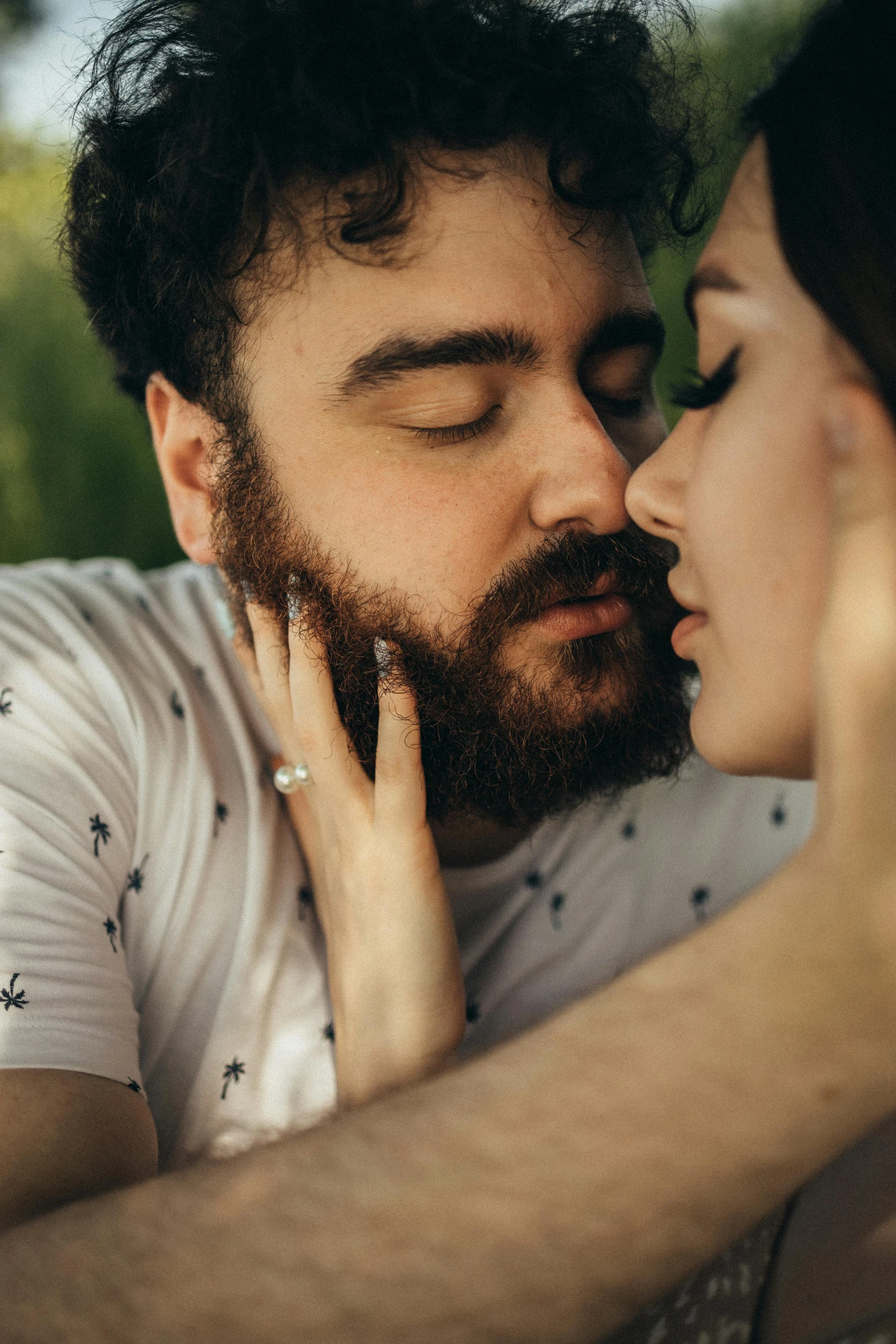 a man kissing a woman on the cheek, trending on pexels, oak leaf beard, square masculine jaw, lesbians, touching