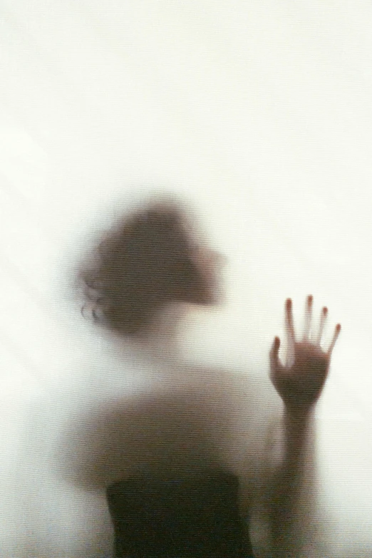 a blurry image of a person with their hands in the air, inspired by Katia Chausheva, romanticism, shadowed face, on a pale background, “ ethereal, instagram photo