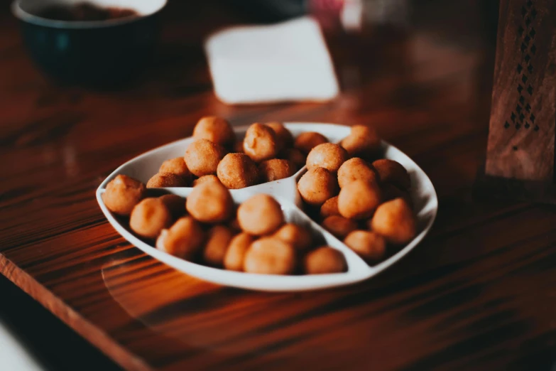 a close up of a plate of food on a table, by Matt Cavotta, unsplash, puffballs, brown, therookies, tradition