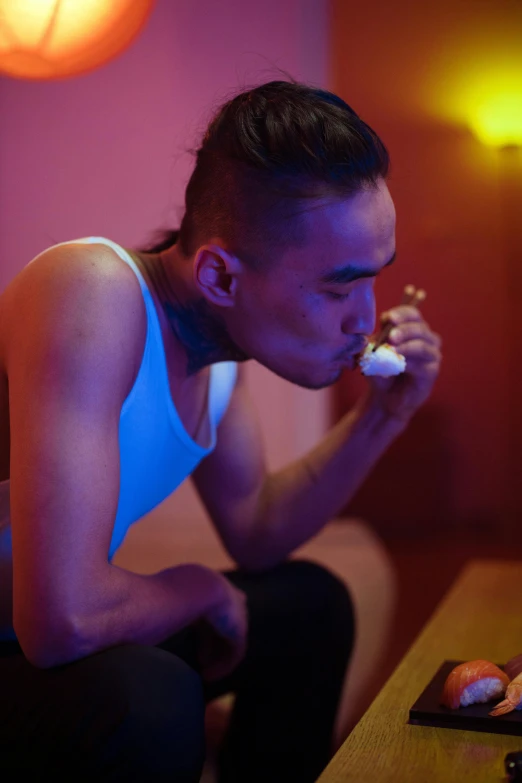 a woman sitting on a couch eating sushi, inspired by Nan Goldin, unsplash, conceptual art, asian man, praying with tobacco, bisexual lighting, profile image