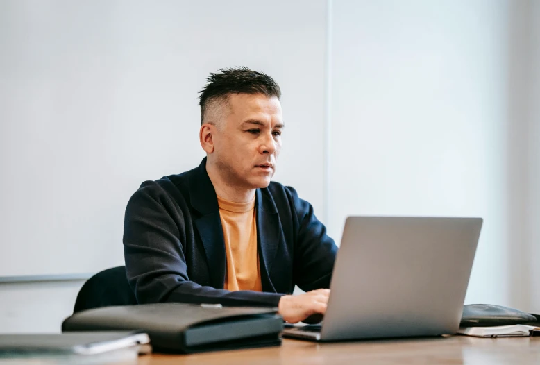 a man sitting in front of a laptop computer, unsplash, jin shan and ross tran, lachlan bailey, profile image, no - text no - logo