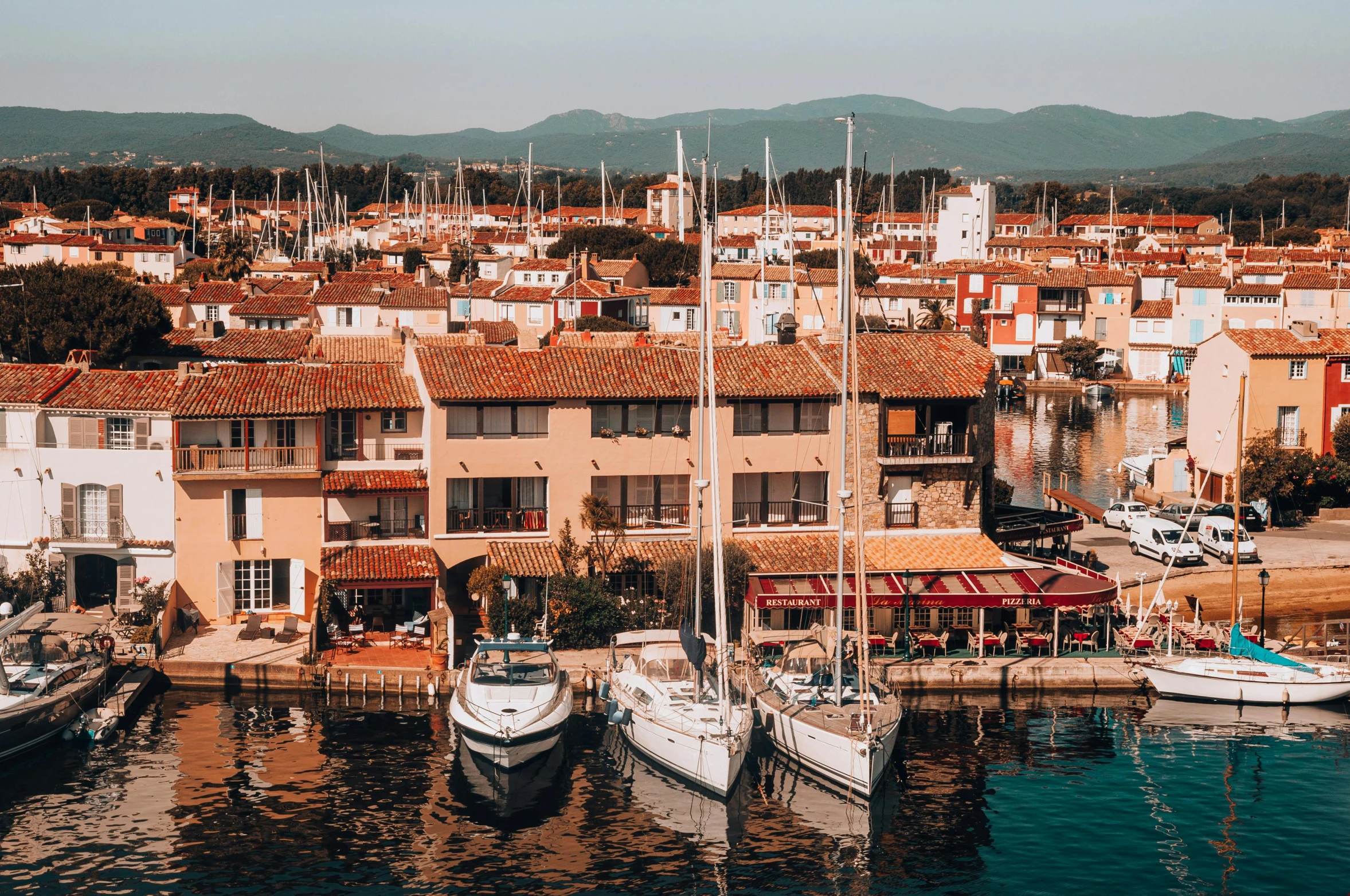 a bunch of boats that are in the water, pexels contest winner, les nabis, french village exterior, 🦩🪐🐞👩🏻🦳, wes anderson film, conde nast traveler photo