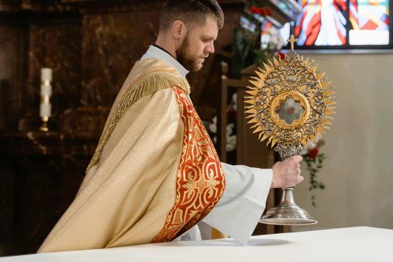 a man in a priest's robes holding a cross, unsplash, baroque, intricate ornament halo, displayed on an altar, profile pic, muscular gigachad benediction