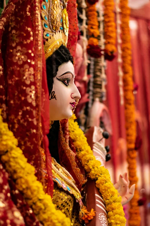 a close up of a statue of a woman, bengal school of art, ornate mask and fabrics, holy ceremony, profile image