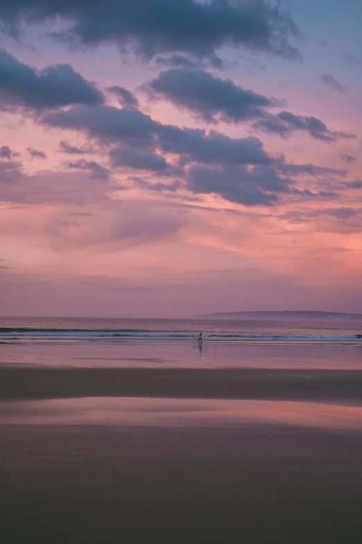 a couple of people standing on top of a sandy beach, pink skies, reflective lavender ocean water, manly, omaha beach