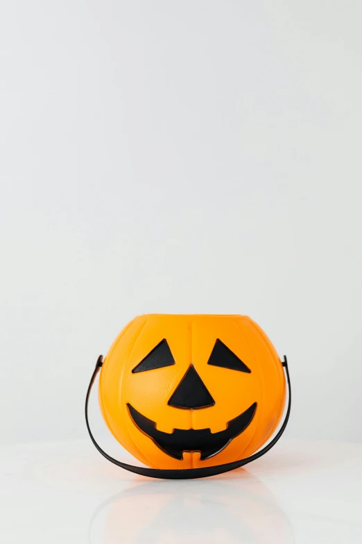 a pumpkin bag sitting on top of a table, profile image, no - text no - logo, f / 1 6, candy