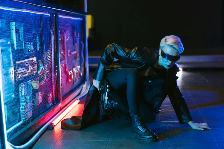 a woman sitting on the ground in front of a tv, cyberpunk art, trending on pexels, cai xukun, exiting store, cosplay on black harley queen, bright lights