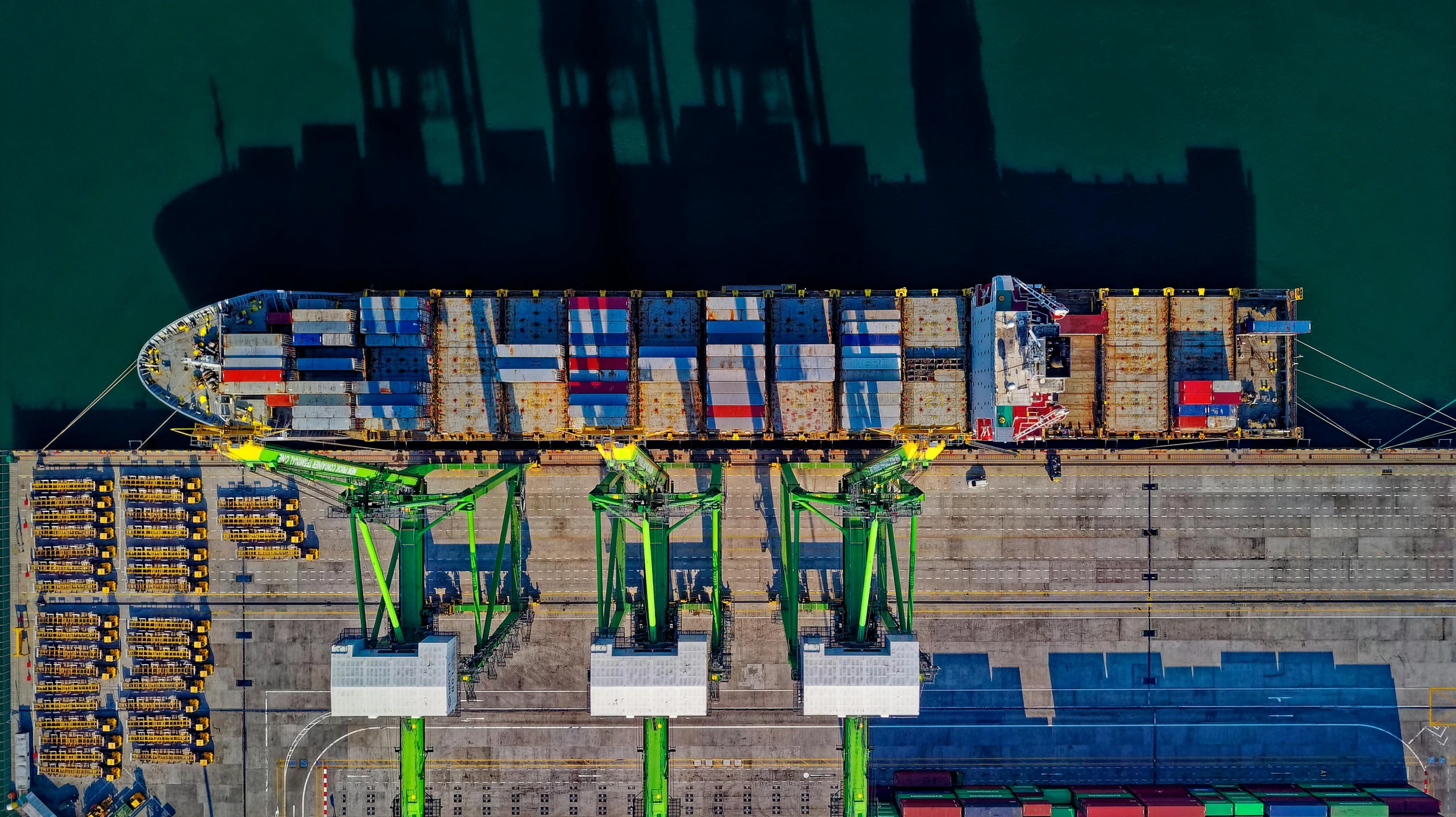 a large container ship sitting on top of a body of water, pexels contest winner, looking at spaceships at dock, top down perspecrive, avatar image, crane shot