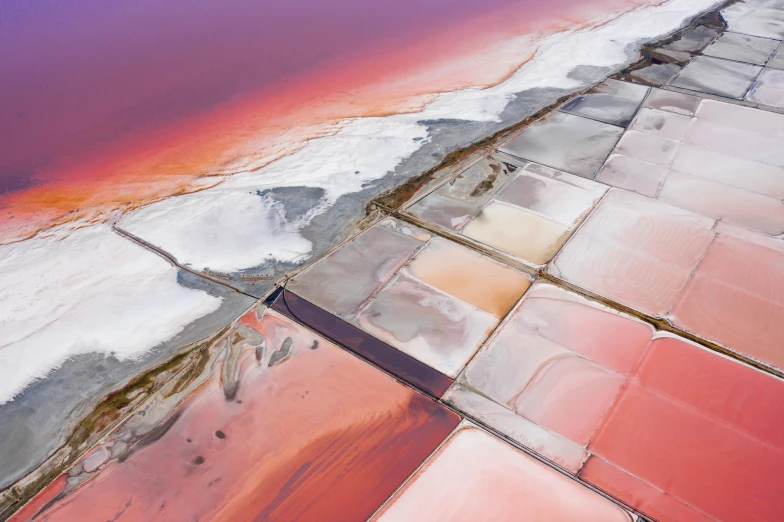 an aerial view of a large body of water, inspired by Scarlett Hooft Graafland, unsplash contest winner, color field, white and pink cloth, mining, multiple stories