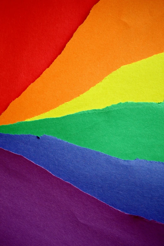 a close up of a rainbow colored piece of paper, an album cover, masculinity, coarse paper, flags, promo image