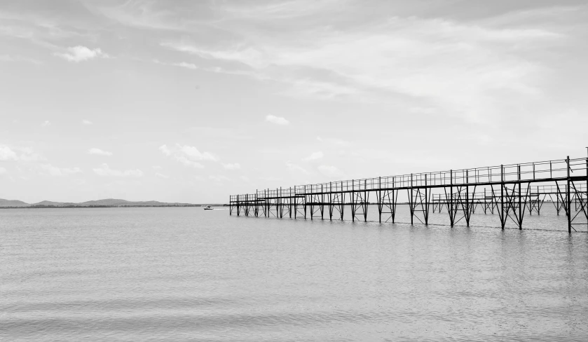 a black and white photo of a pier, unsplash, minimalism, huge suspended wooden bridge, photographic print, 256x256, listing image