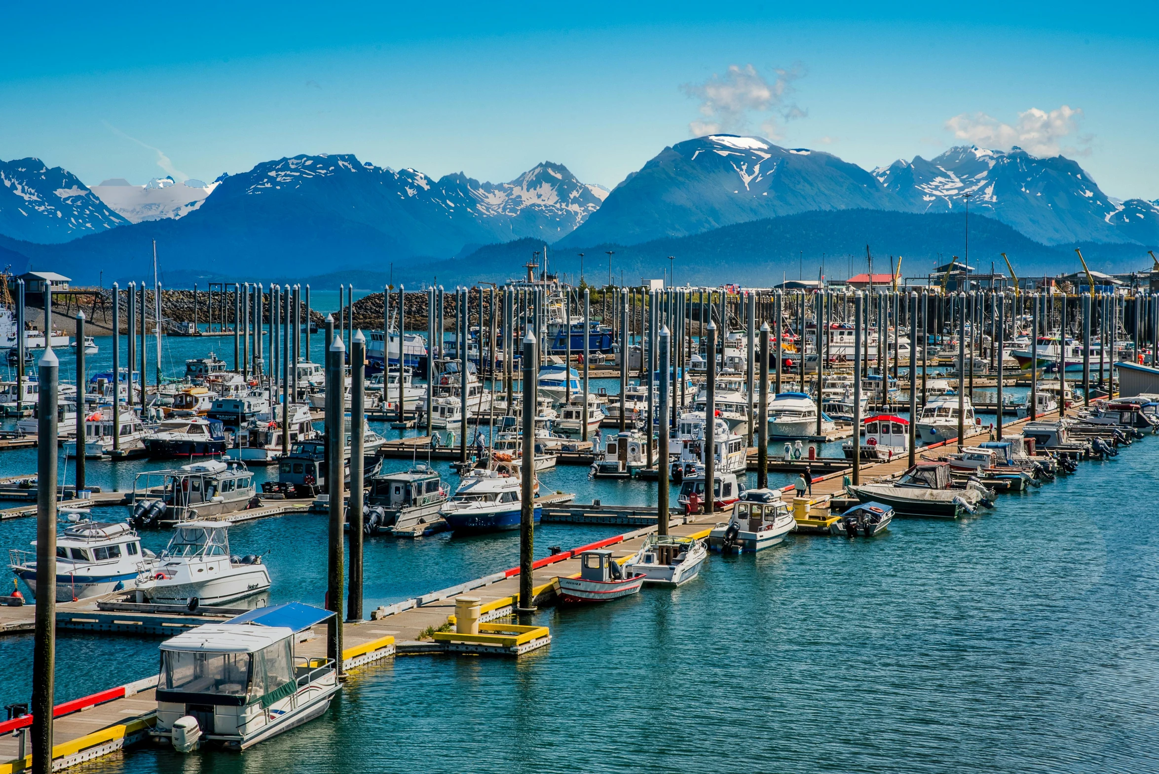 a harbor full of boats with mountains in the background, by Meredith Dillman, pexels contest winner, ballard, 4k photo gigapixel, multiple stories, thumbnail