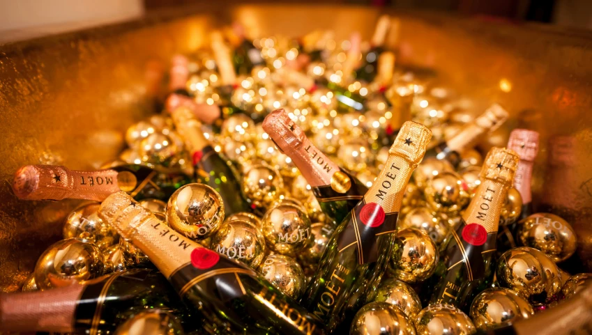 a wooden box filled with lots of bottles of champagne, by Julia Pishtar, happening, golden ornaments, thumbnail, covered in, sunken