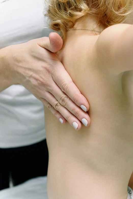 a close up of a person touching a child's back, mascular, centered shoulders up view, diagnostics, panoramic