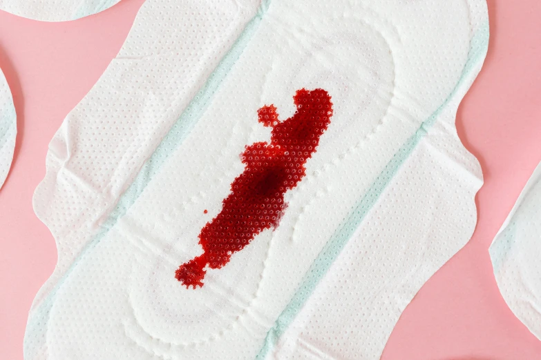 a pair of sanitary pads with a blood stain on them, by Julia Pishtar, bottom - view, detailed product image, spilling ketchup, detail shot