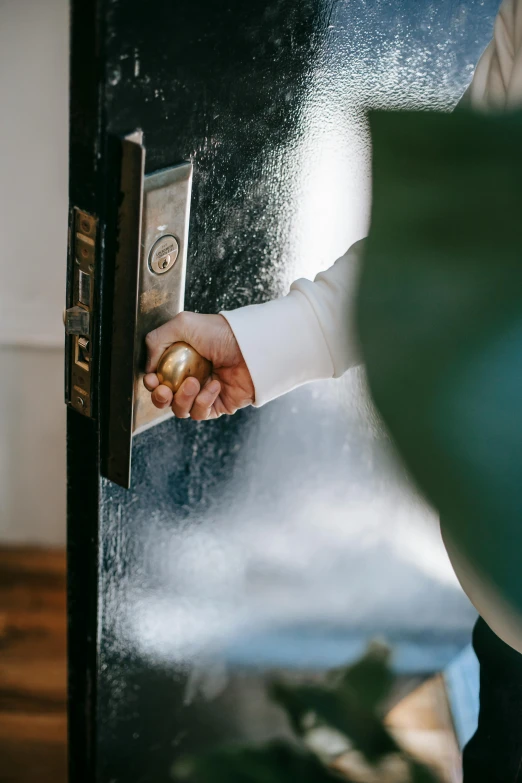 a close up of a person opening a door, a stock photo, by Julia Pishtar, private press, leaking, luxury, milkman, ignant