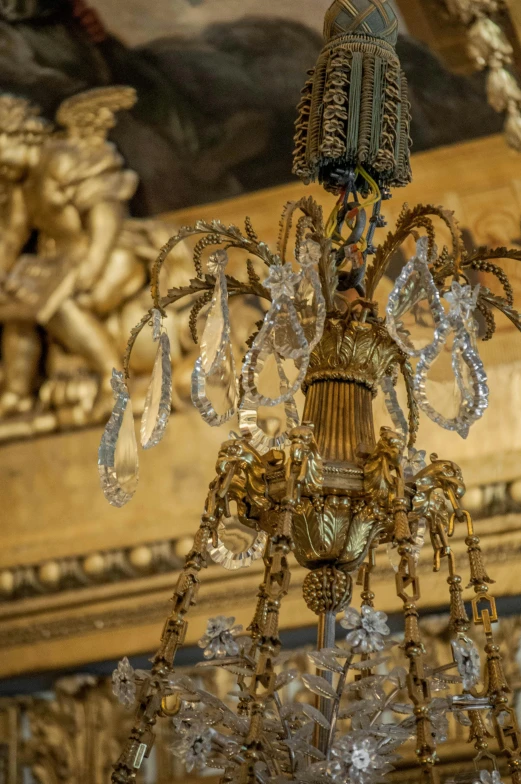 a chandelier hanging from a ceiling in a room, a portrait, pexels contest winner, baroque, detailed carved ornaments, side view intricate details, gilded gold and diamonds, taken in the early 2020s