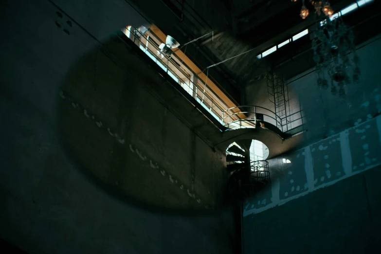 a clock that is on the side of a building, a detailed matte painting, unsplash contest winner, bauhaus, working inside reactor room, spotlight from above, photo taken on fujifilm superia, at inside of a future submarine