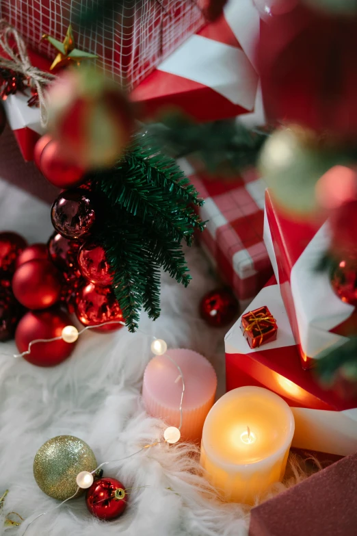 a christmas tree decorated with red and white ornaments, a still life, trending on pexels, glowing candles, flat lay, profile image, detail shot