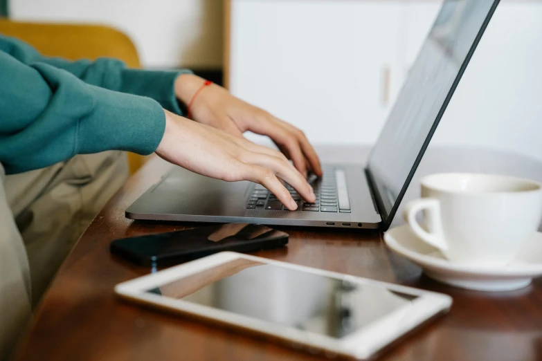 a close up of a person typing on a laptop, by Carey Morris, trending on pexels, center focus on table, various posed, avatar image, maintenance