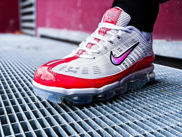 a close up of a person's shoes on a grate, a digital rendering, unsplash, graffiti, white red, nike air max, vials, big chin