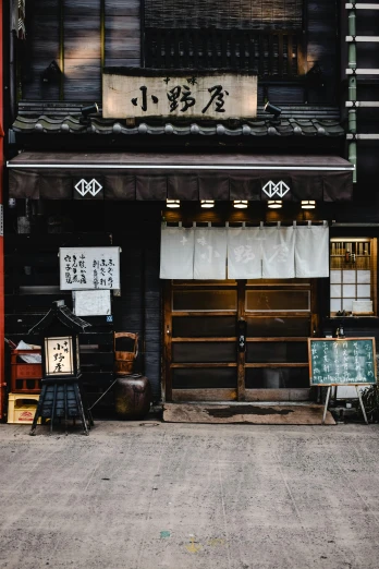 a couple of bikes parked in front of a building, a silk screen, inspired by Watanabe Shōtei, trending on unsplash, a multidimensional cozy tavern, square, old signs, high quality photo