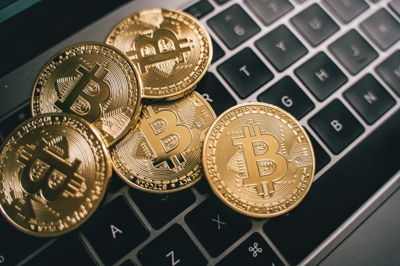 a pile of bitcoins sitting on top of a laptop keyboard, trending on pexels, renaissance, avatar image, instagram photo, 🦩🪐🐞👩🏻🦳, detailed product image