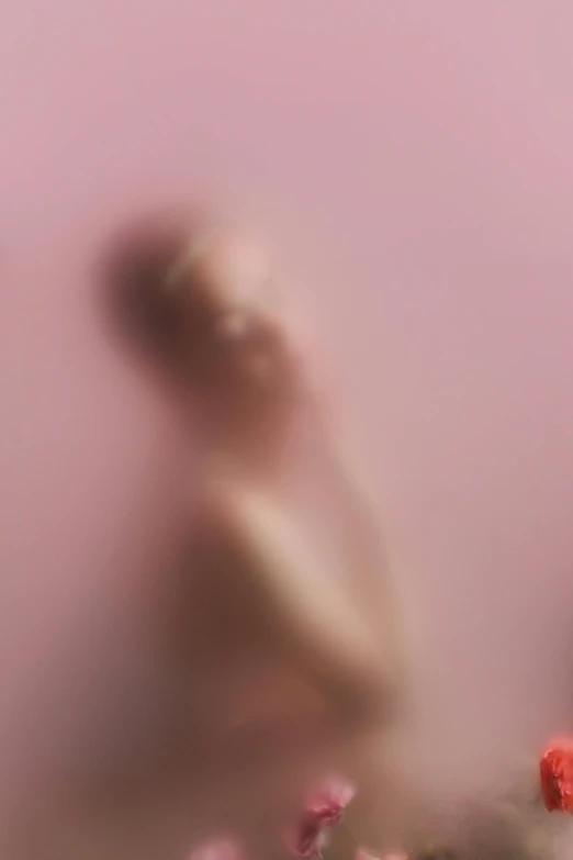 a blurry image of a woman in a field of flowers, inspired by Anna Füssli, conceptual art, pink water in a large bath, dust clouds | homoerotic, pink studio lighting, pareidolia