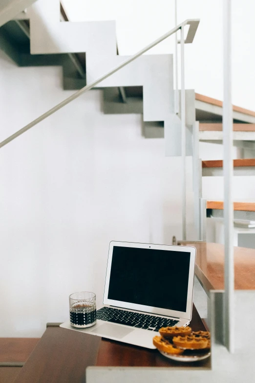 a laptop computer sitting on top of a wooden table, unsplash, modernism, 1 staircase, white background, multiple stories, dwell