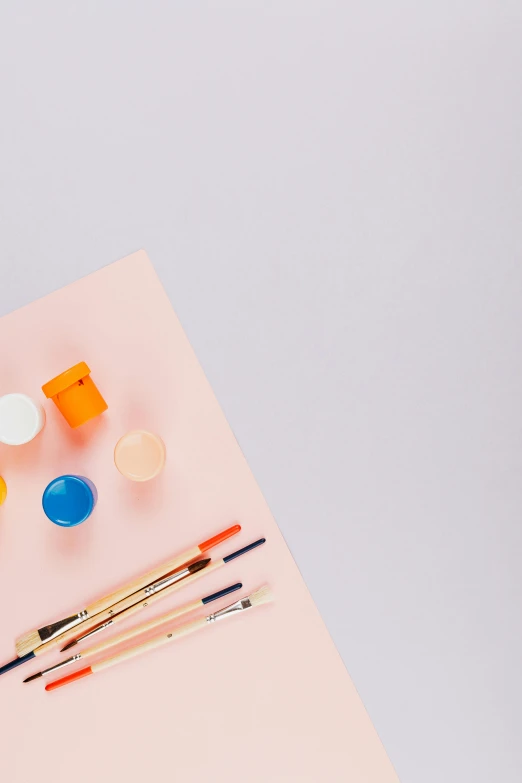 art supplies laid out on a pink surface, a minimalist painting, trending on unsplash, orange and purple color scheme, on a pale background, “ painting, detailed product image