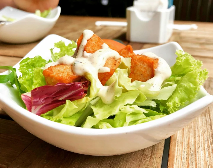 a close up of a plate of food on a table, lettuce, square, yotobi, medium