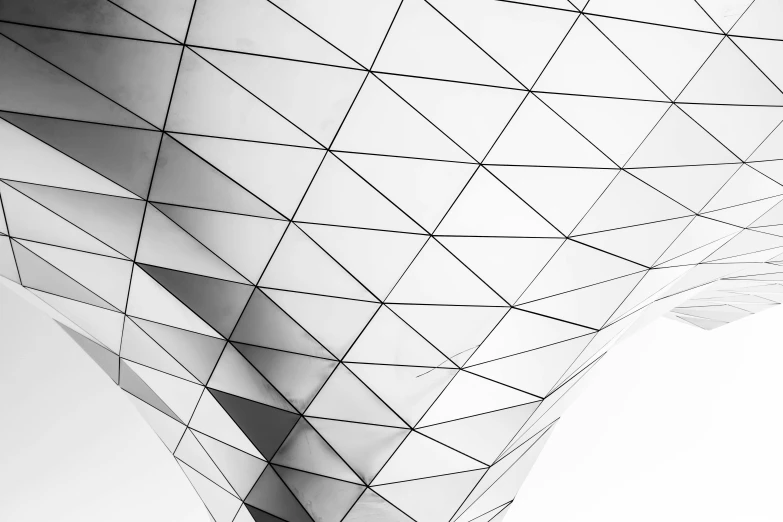 a black and white photo of a building, unsplash contest winner, minimalism, white polygonal dress, made out of shiny white metal, white background, macro up view metallic