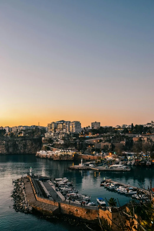 a large body of water next to a city, by Tom Bonson, pexels contest winner, lebanon kirsten dunst, sundown, harbour, flat lay