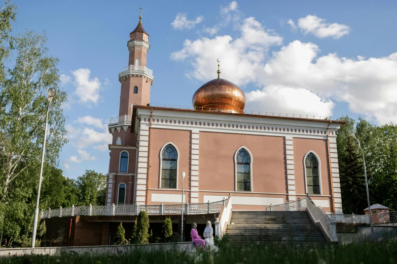 a couple of people that are standing in front of a building, hurufiyya, mosque, russia in 2 0 2 1, fan favorite, exterior