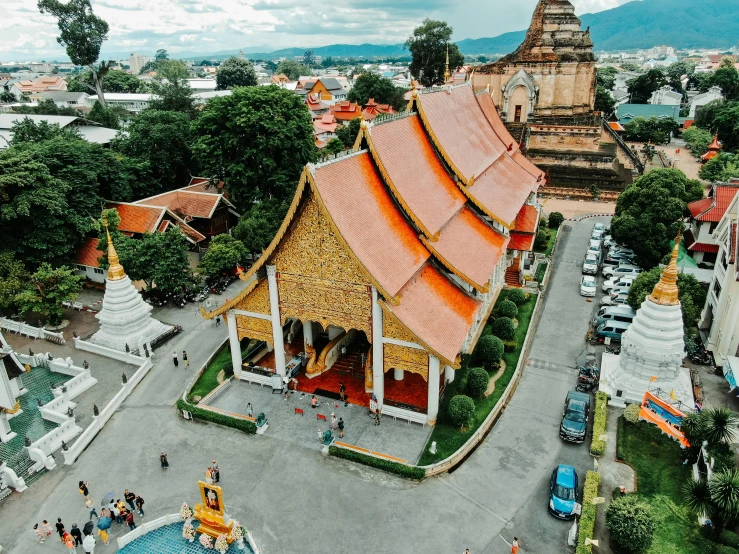 an aerial view of a buddhist temple in thailand, 🦩🪐🐞👩🏻🦳, square, background image, orange roof