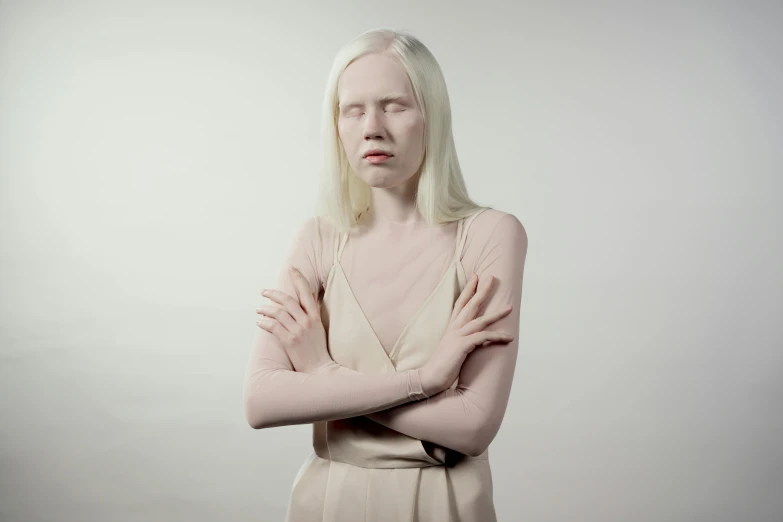 a woman with white hair standing with her arms crossed, inspired by Vanessa Beecroft, intense albino, silicone skin, silver，ivory, greta thunberg as gollum